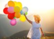 a woman running with balloons while learning benefits of tms therapy