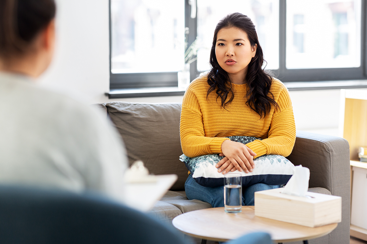 woman in therapy session for Signs of Depression